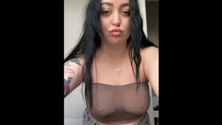 Sexy brunette shakes her tits.