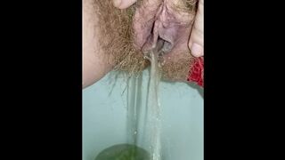 Gorgeous fart and massive waterfall of piss from a juicy hairy pussy in red panties closeup