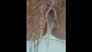 Hairy Pussy Girl Peeing Close Up in the Toilet Labia Spread with Wide Open Pee Hole