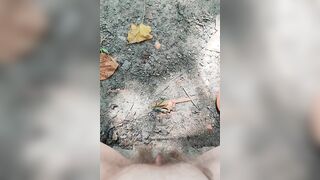 Girl pisses in wood on dry ground