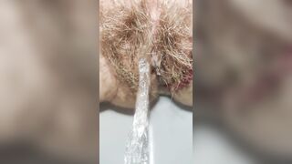 Schoolgirl with small ass but big hairy pussy pissing for you super mega closeup