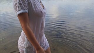 Tender girl. Nymph walks in a wet transparent shirt