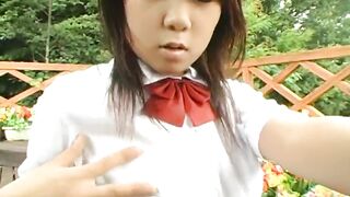 Naughty asian schoolgirl does a striptease