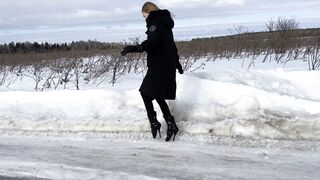 The girl is trying to walk on ice in ballet boots, but her toes are very painful